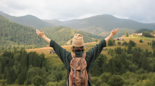 1767967329-young-female-traveler-enjoying-rural-surroundings