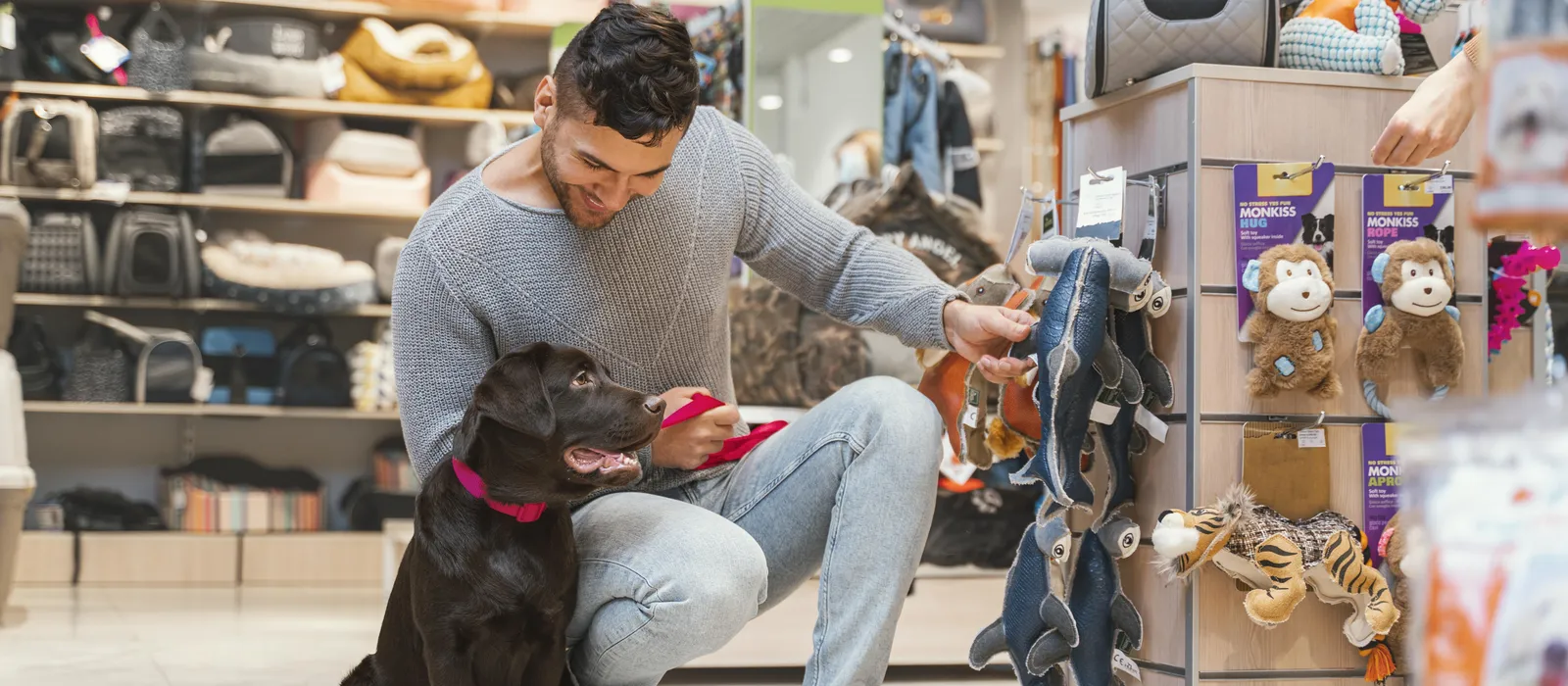 1769868755-cute-dog-with-owner-pet-shop