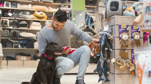 1769868891-cute-dog-with-owner-pet-shop