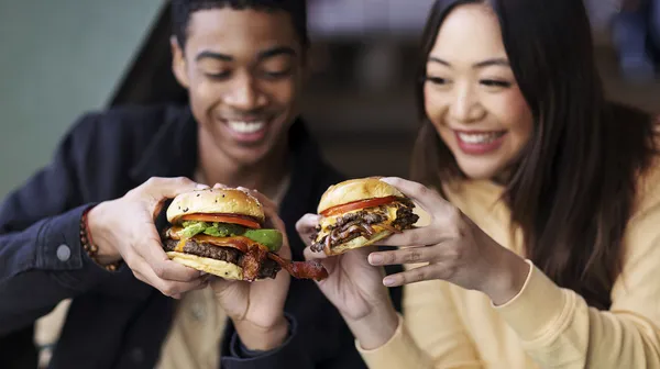 1760095185-young-adults-enjoying-food