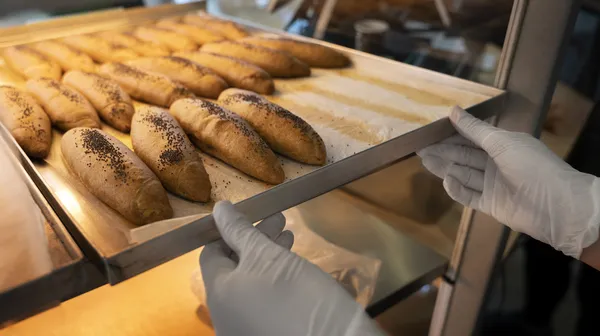 1760686588-high-angle-woman-working-bakery