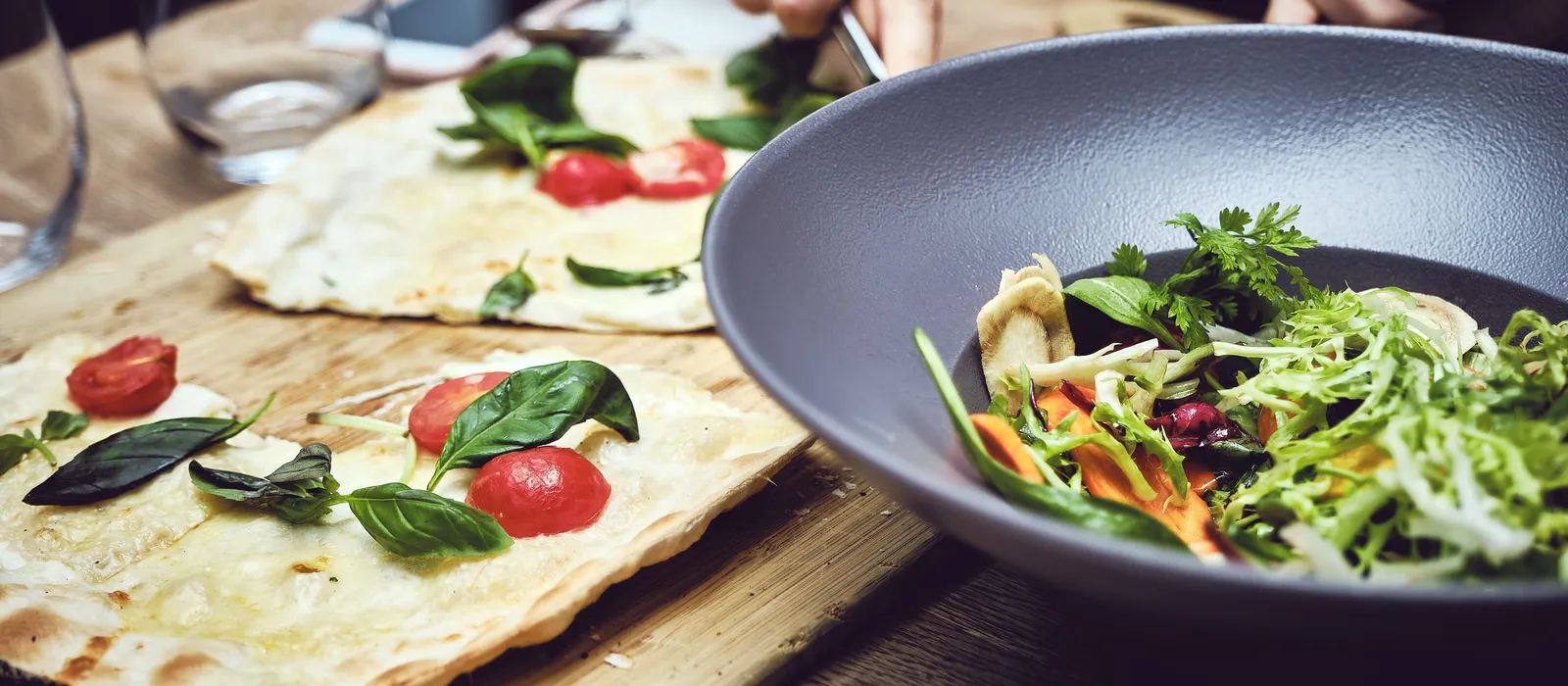 1760686958-closeup-shot-person-cutting-vegetable-making-salad