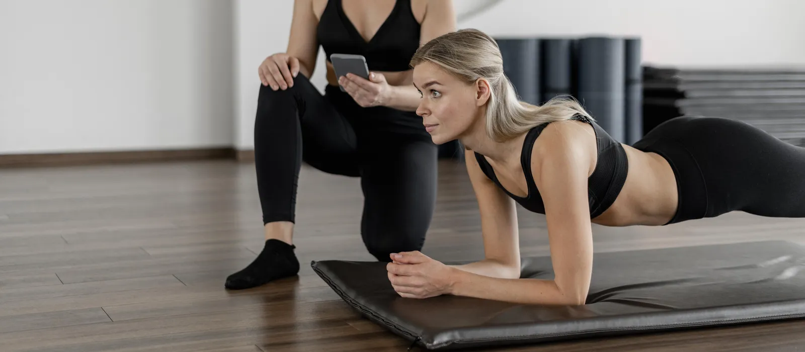 1761901204-young-woman-exercising-gym-doing-plank