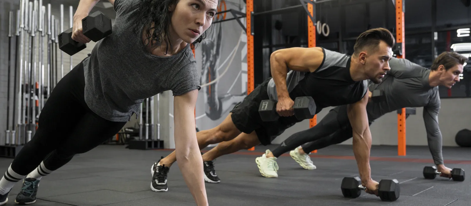 1765820175-people-working-out-indoors-together-with-dumbbells