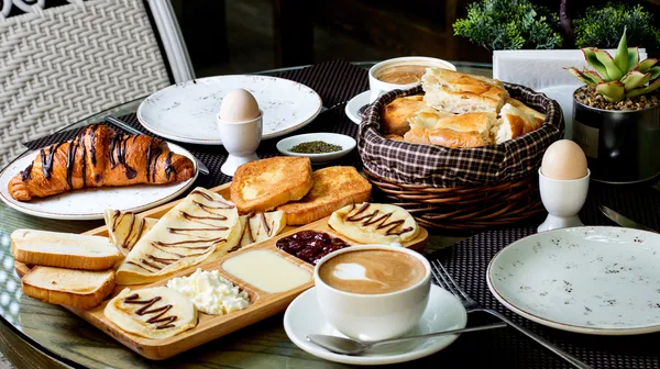 1778317786-cup-hot-cappuccino-chocolate-croissant-with-breakfast