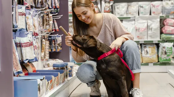 Adorable dog with owner pet shop