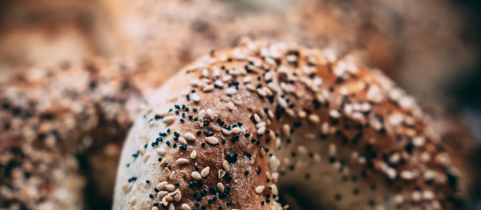 Closeup shot bunch bagels covered sesame seeds