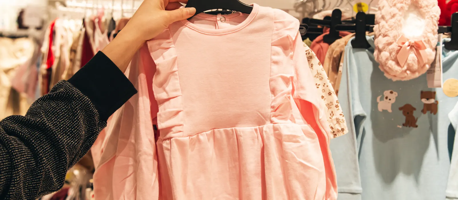 Little pink dress baby store mother doing shopping baby shop