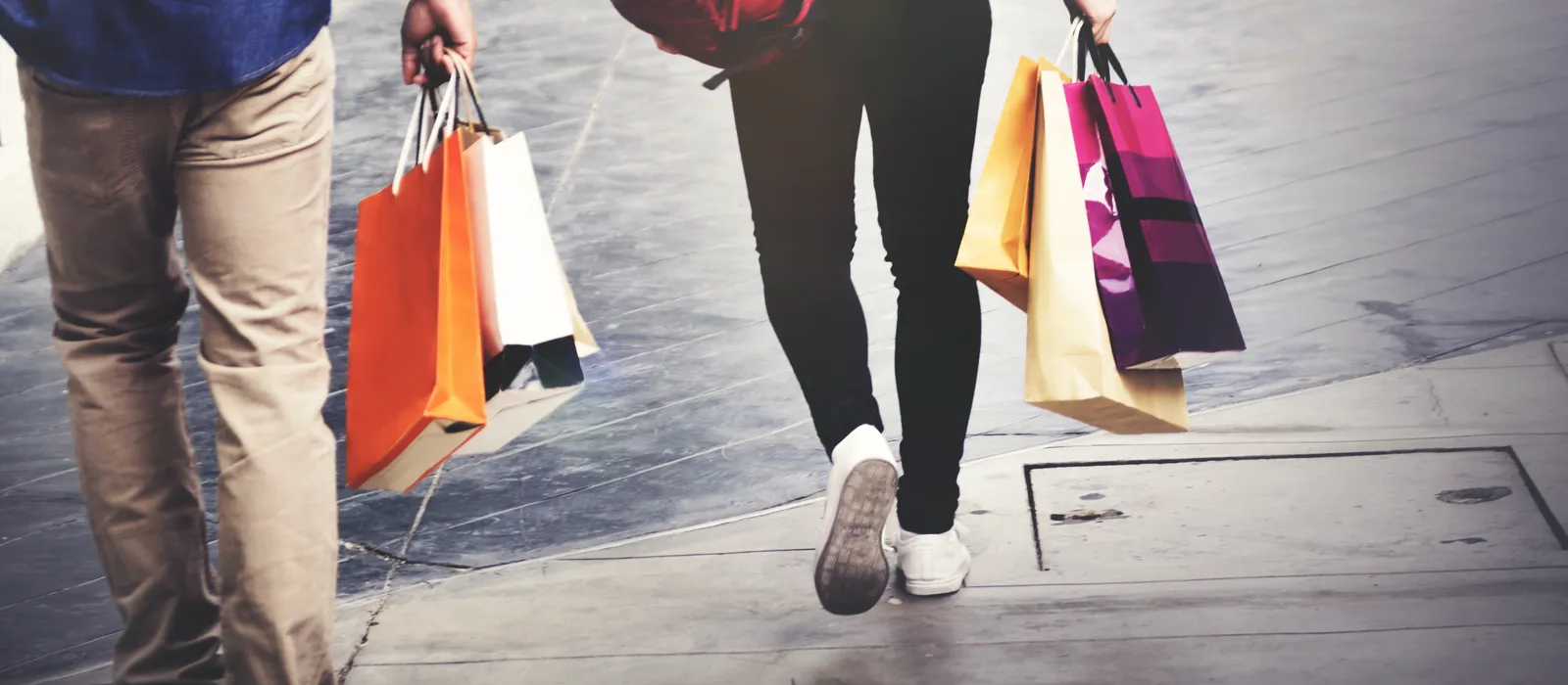 People walking with shopping bags