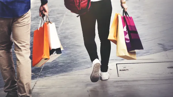 People walking with shopping bags
