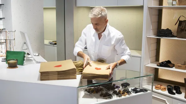 Manager preparing store reopening